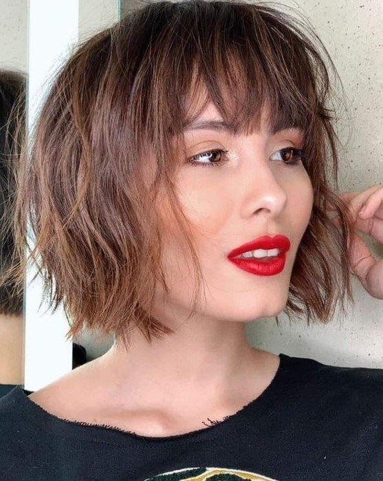 a messy and textural short brunette bob with layers and fringe is a fantastic idea if you want a bit of rock