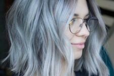 a pale blue choppy long bob with a darker root adn waves is a lovely idea for a soft and modern look