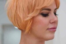 a peach razor cut bixie featuring length on the bottom and texture throughout the top, it’s easy to style