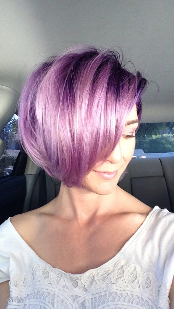 a purple angled bob with side bangs and a lot of volume is a stylish adn catchy idea that looks modern and fresh