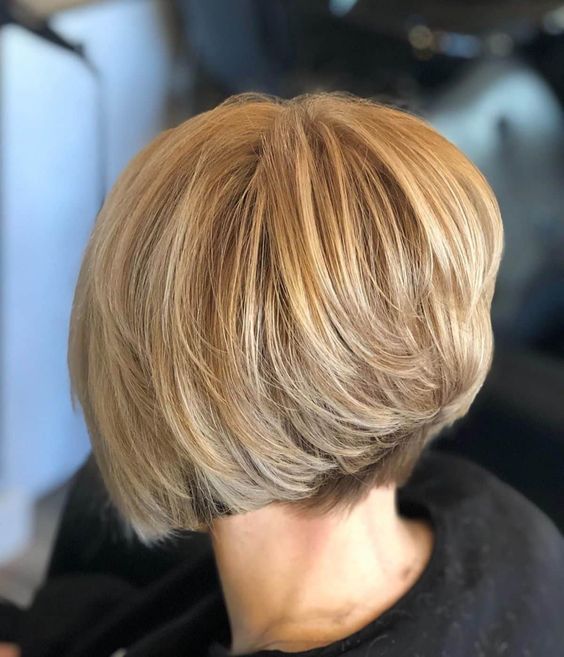 a short angled bob with gold blonde on top and a lot of volume is an amazing idea to rock, it looks geometric and catchy