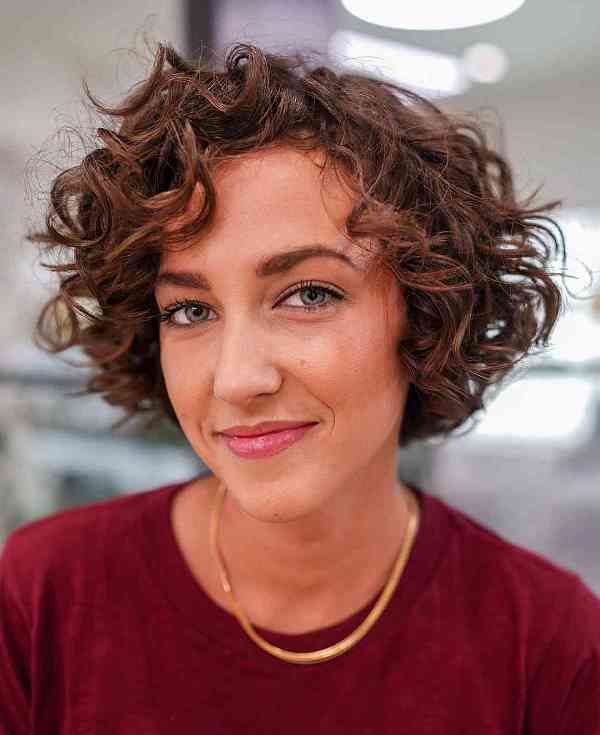 a short curly bob with square layers to maintain bouncy nature is a cool and chic idea