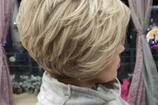 a short feathered bob with textured layers is a voluminous style to rock, and its full wispy shape will turn heads