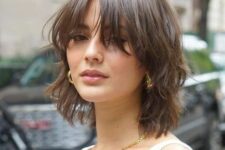a short wolf cut in brown with bottleneck bangs and texture is a cool idea if you want a wolf cut but a shorter one