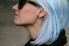 a straight pastel blue long bob with a bit of lilac locks is a stylish and catchy idea that looks modern