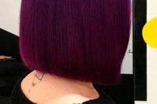 a super bold deep purple straight and shiny long bob is a very stylish and catchy idea, and this color mesmerizes