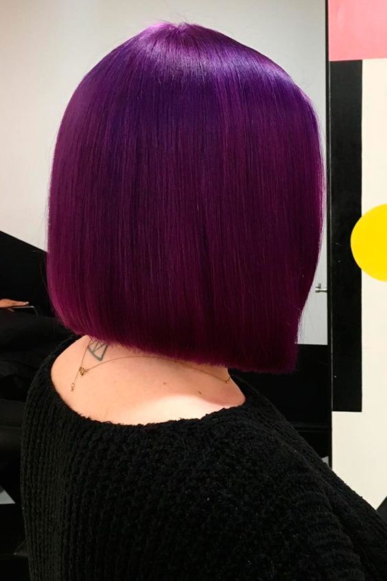 a super bold deep purple straight and shiny long bob is a very stylish and catchy idea, and this color mesmerizes