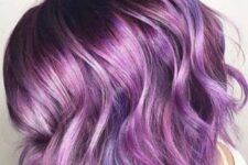 a super bold purple chopped and angled wavy bob with shiny hair is an amazing idea to rock right now
