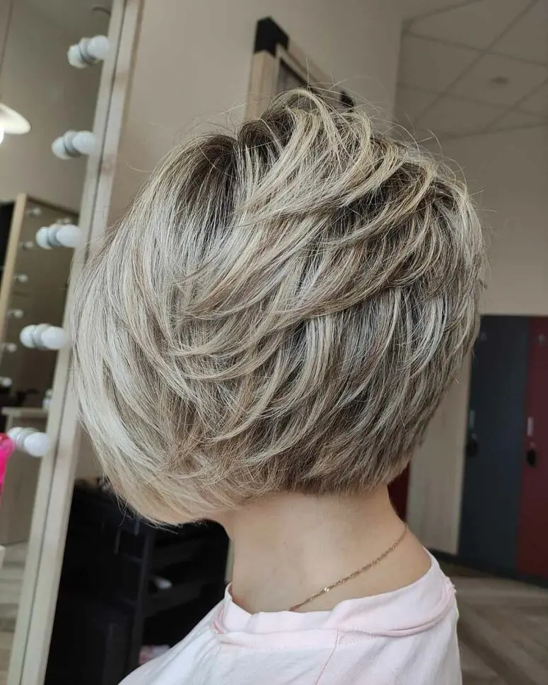 a textured feathered bob haircut with soft choppy layers is versatile and cool and you can make it look different