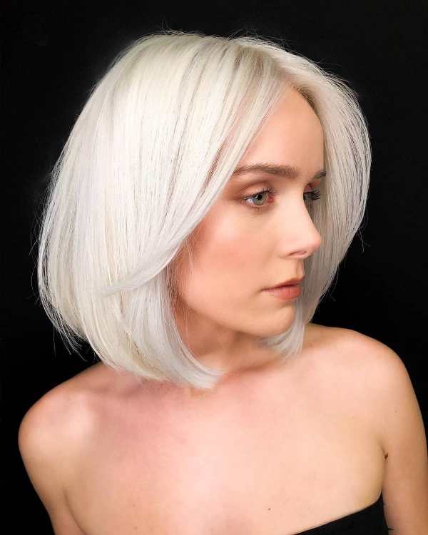 a textured icy blonde long bob for fine hair to allow slight volume with a bulkier shape