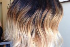 a wavy long bob with black to caramel and bleached blonde, with a lot of volume is super bold
