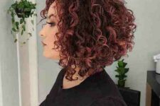 an auburn curly angled bob with graduated layers to give height and remove bulk is a beautiful idea with a lot of volume