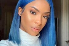 an electric blue long bob with central part and straight hair is a super bold and catchy idea for a modern look
