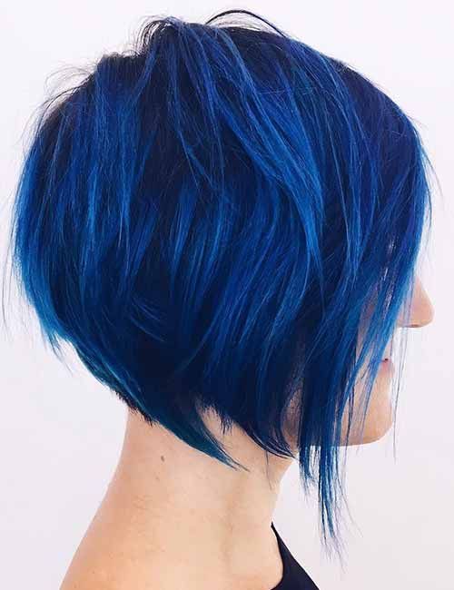 an extremely bold blue angled chopped bob with a lot of volume and textured hair is amazing