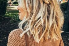 beachy blonde balayage with waves and a fishtail braid on one side are a great idea to give a summer feel to your look
