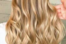 long bronde hair with gold blonde balayage and waves is a gorgeous princess-style hairstyle to try