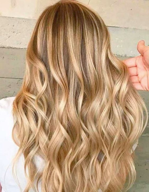 Long bronde hair with gold blonde balayage and waves is a gorgeous princess style hairstyle to try