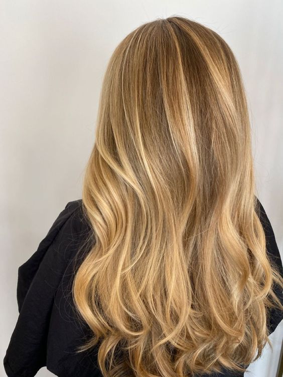 long bronde hair with gold blonde balyage and waves is a gorgeous and chic idea that is always classic