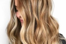 long brunette hair with honey and gold blonde balayage and waves is a messy and chic idea to rock any time and any season