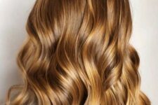 long brunette hair with honey blonde highlights and waves is a very romantic and girlish idea to rock