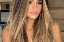 long dark brown hair with caramel and honey blonde balayage and babylights is a beautiful solution with much dimension and a beachy feel