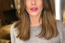 long light brown hair with some honey highlights and chin bangs plus middle part is a gorgeous idea that is effortlessly chic