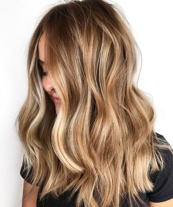 Long light bruntte hair with gorgeous honey and gold blonde highlights and waves plus face framing locks is amazing