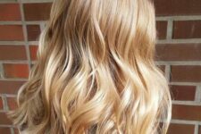 long wavy gold blonde locks are a classic idea for everyone, this shade of blonde never goes out of style