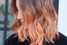 ombre wavy hair from burgundy chestnut to strawberry blonde is a bright statement