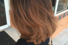 pretty shoulder-length hair with an ombre effect from black to copper, with layers and a lot of volume is adorable