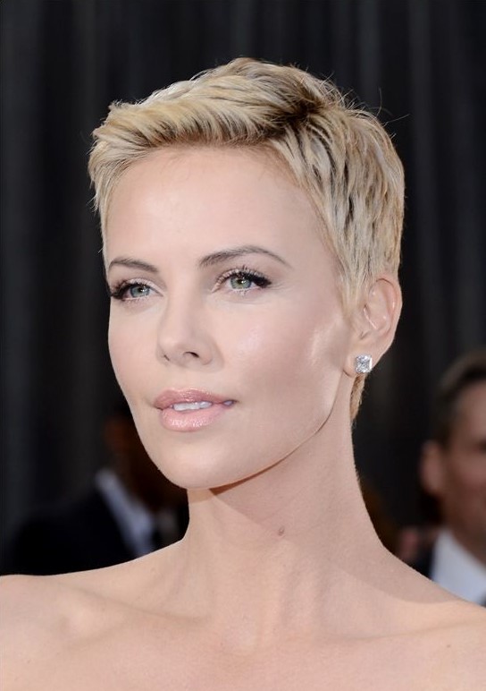 Charlize Theron rocking a chic short blond pixie haircut looks heavenly