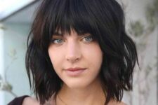 a black choppy bob with fringe bangs and waves is a lovely idea to rock and it looks fresh, bold and rebellious