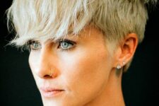 a blonde layered pixie with a longer top and front cut in layers and outgrown fringe is a catchy and rock-style idea