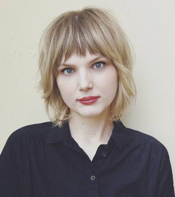 a blonde shaggy chin-length bob with a fringe and face-framing layers is a very cool and cute idea