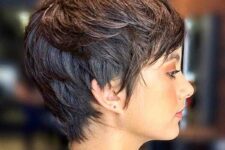 a brunette layered pixie on thin hair, with texture paste to create a volume and make a lovely finish