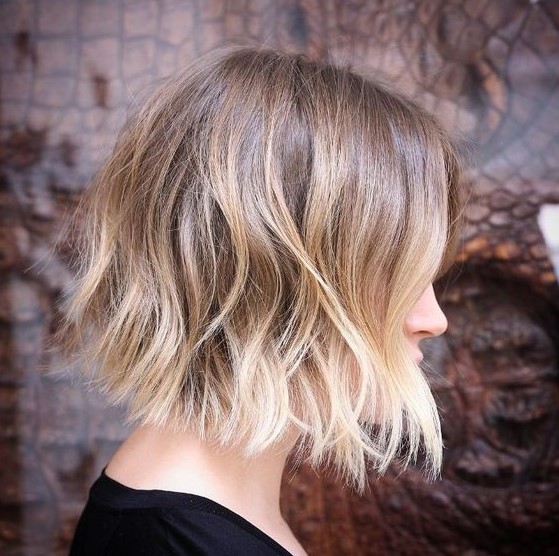 a chic light brunette wavy bob with blonde ombre and money piece is a very fresh and modern idea
