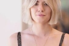 a chin-length icy blonde bob with central parting and Bardot bangs is a stylish idea to rock