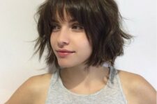 a choppy short bob with bangs is a great modern option, spruce it up with messy waves