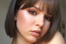 a classy shower brunette bob with curtain and fringe bangs is a veyr cute and very girlish idea