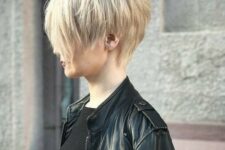 a cool layered and shaggy pixie haircut for daring girls done in a soft and warm blonde shade