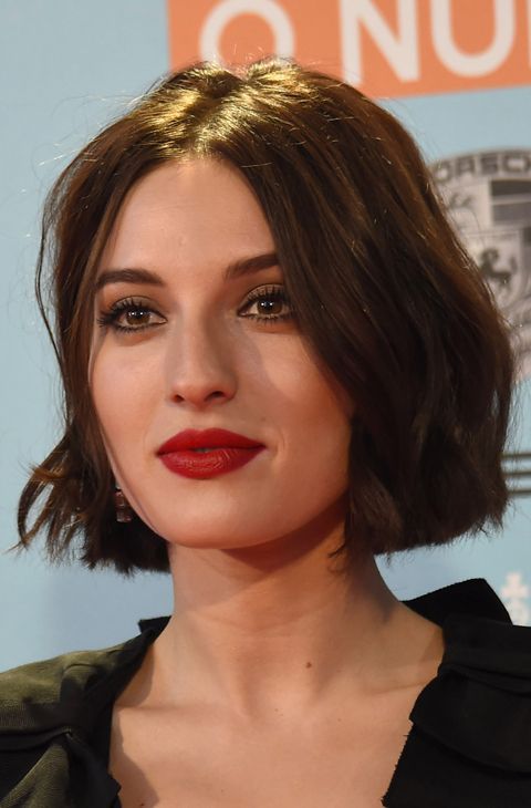a dark brunette slightly wavy midi bob with central parting is a cool and bold idea you can try any time