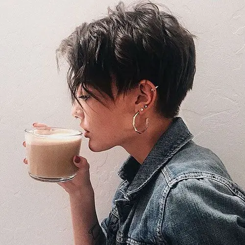 a layered brunette pixie haircut with textured waves is a cool and bold idea to rock, you can style such a pixie in different waves