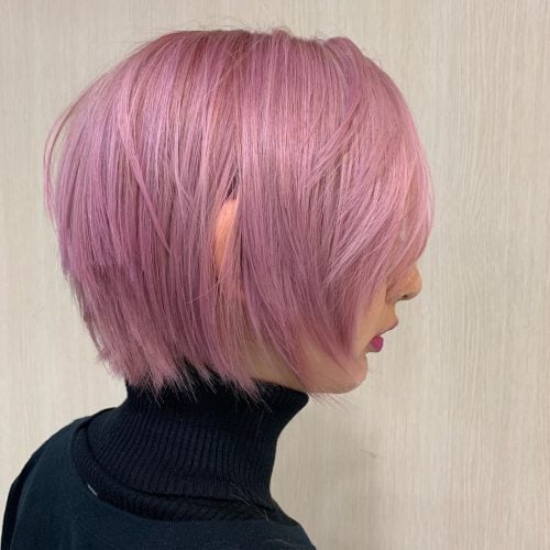 a layered pink bob with side bangs is a gorgeous modern idea that will make a statement with its color