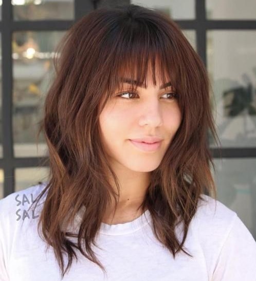a long shaggy bob with bangs will give your look a bit of grunge