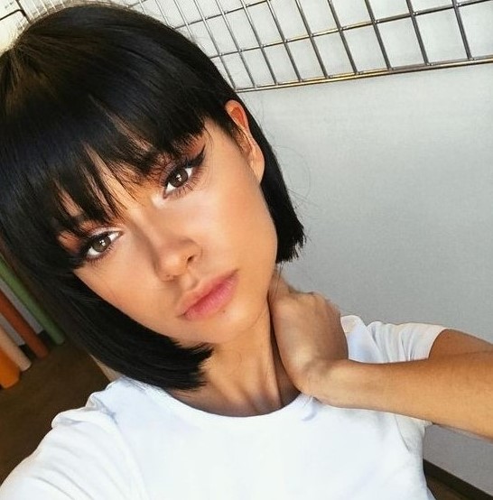 a lovely black boy bob with fringe bangs for a super cute, doll-like look is a timeless idea