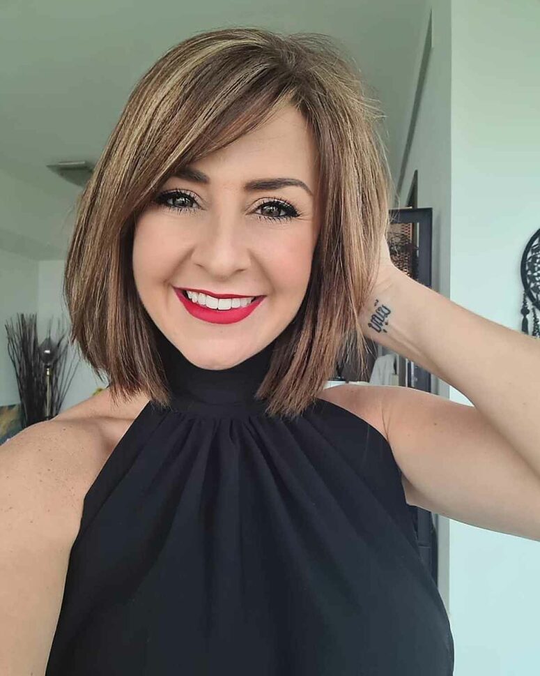 a medium bob with blonde balayage and side bangs is a lovely idea for a fresh and youthful look, and the color combo is great