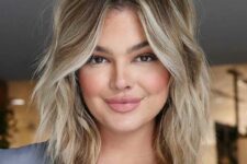 a medium layered and choppy haircut with blonde balayage and waves is a very cool and lovely idea