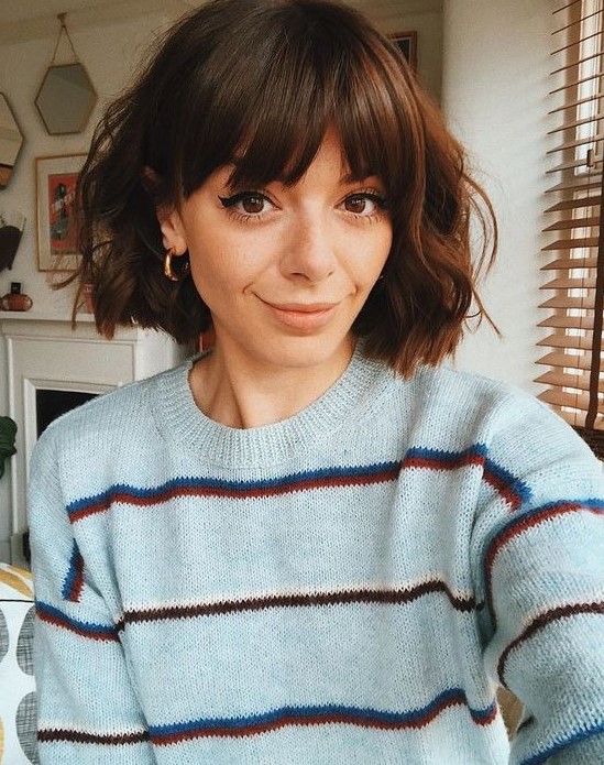 a midi brunette bob with waves and bangs is a lovely and very girlish idea for any time