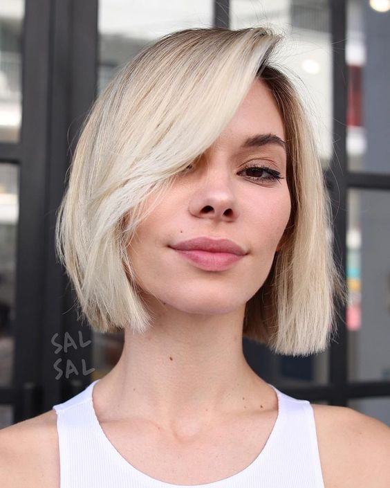 a pretty blonde midi bob with side bangs is always a good idea if you love blonde, add texture and volume to it