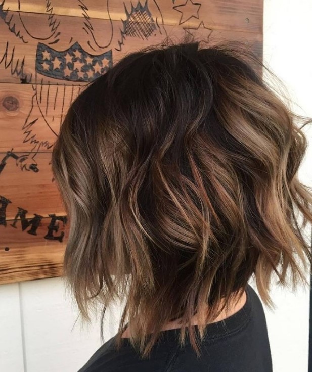 a razored layered bob with a darker root and caramel balayage looks dimensional and voluminous